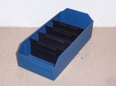Plastic storage bins wih dividers.